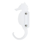 Seahorse-shaped white wall hook isolated on white background.
