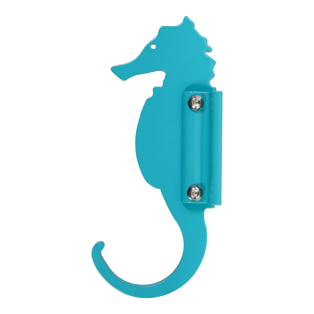 Turquoise seahorse-shaped wall hook.