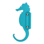 Turquoise seahorse-shaped wall hook.