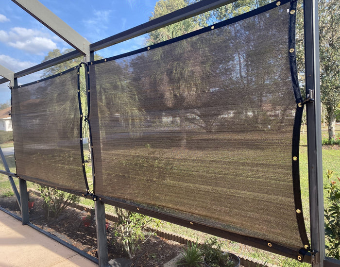 Shade screens hung along the enclosure exterior.