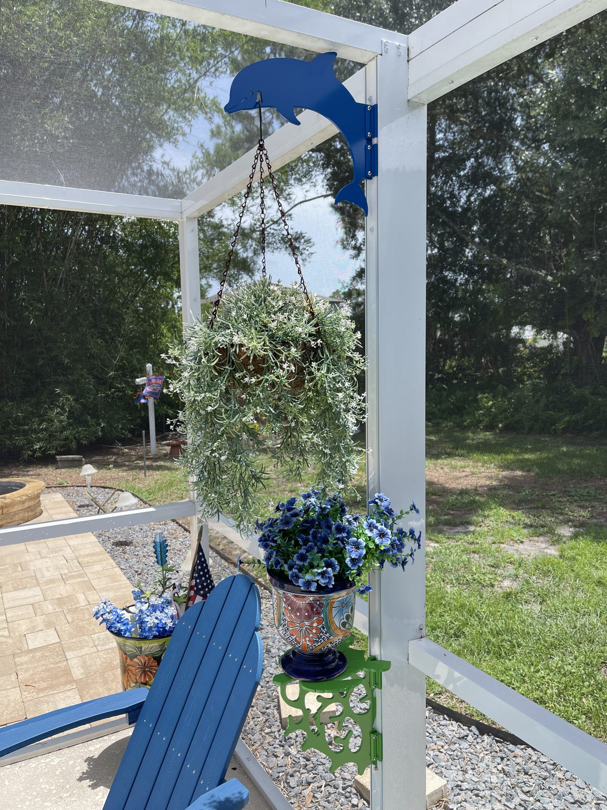 Patio with flowers and blue chair