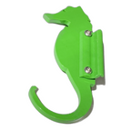 Green seahorse-shaped wall hook on white background.
