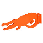 Orange crocodile-shaped wall hook on white background.