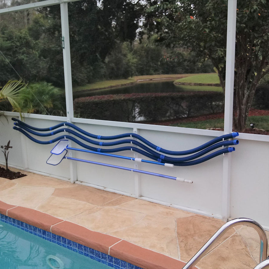 Blue pool hoses hung on Basic hooks on white kick-plate.