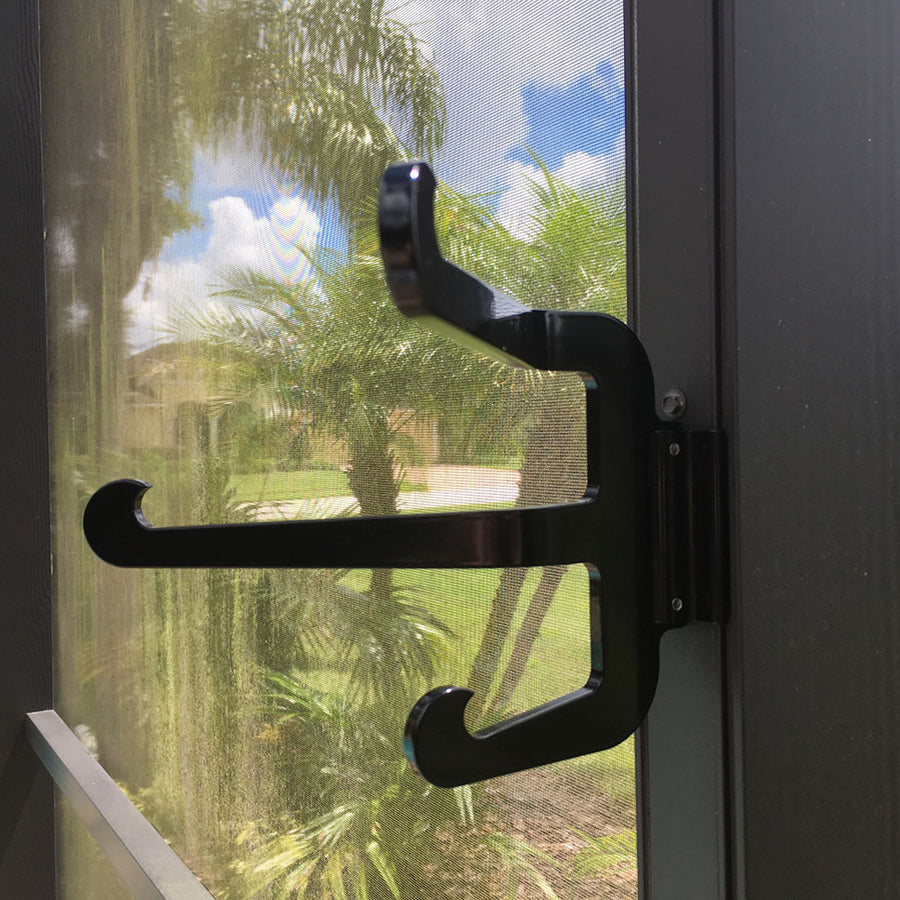 Black Basic Triple hook on dark post, palms beyond.