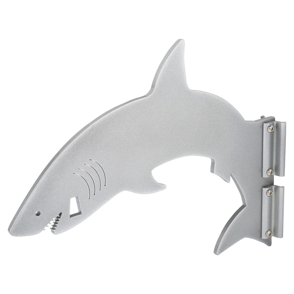 Silver shark-shaped bottle opener on white background.
