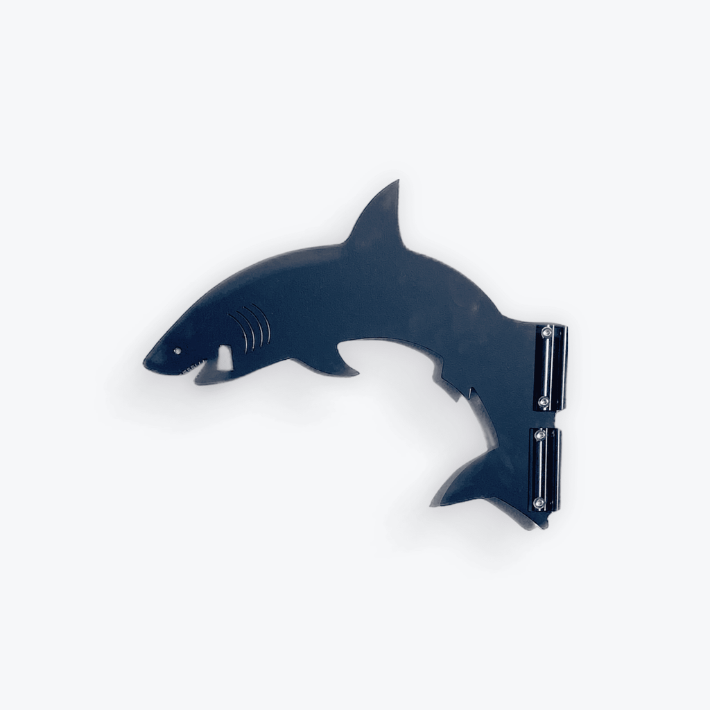 Shark-shaped wall shelf in dark blue.